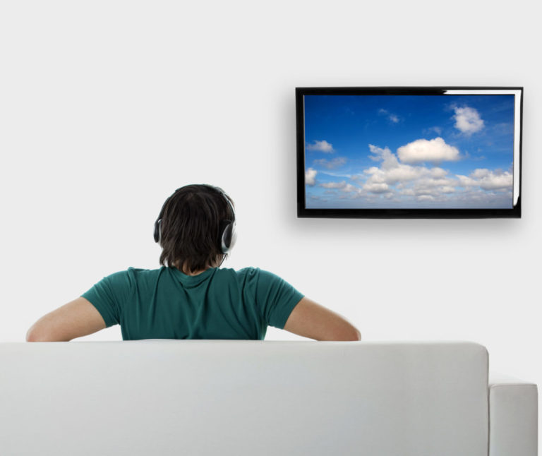 man watching clouds on tv
