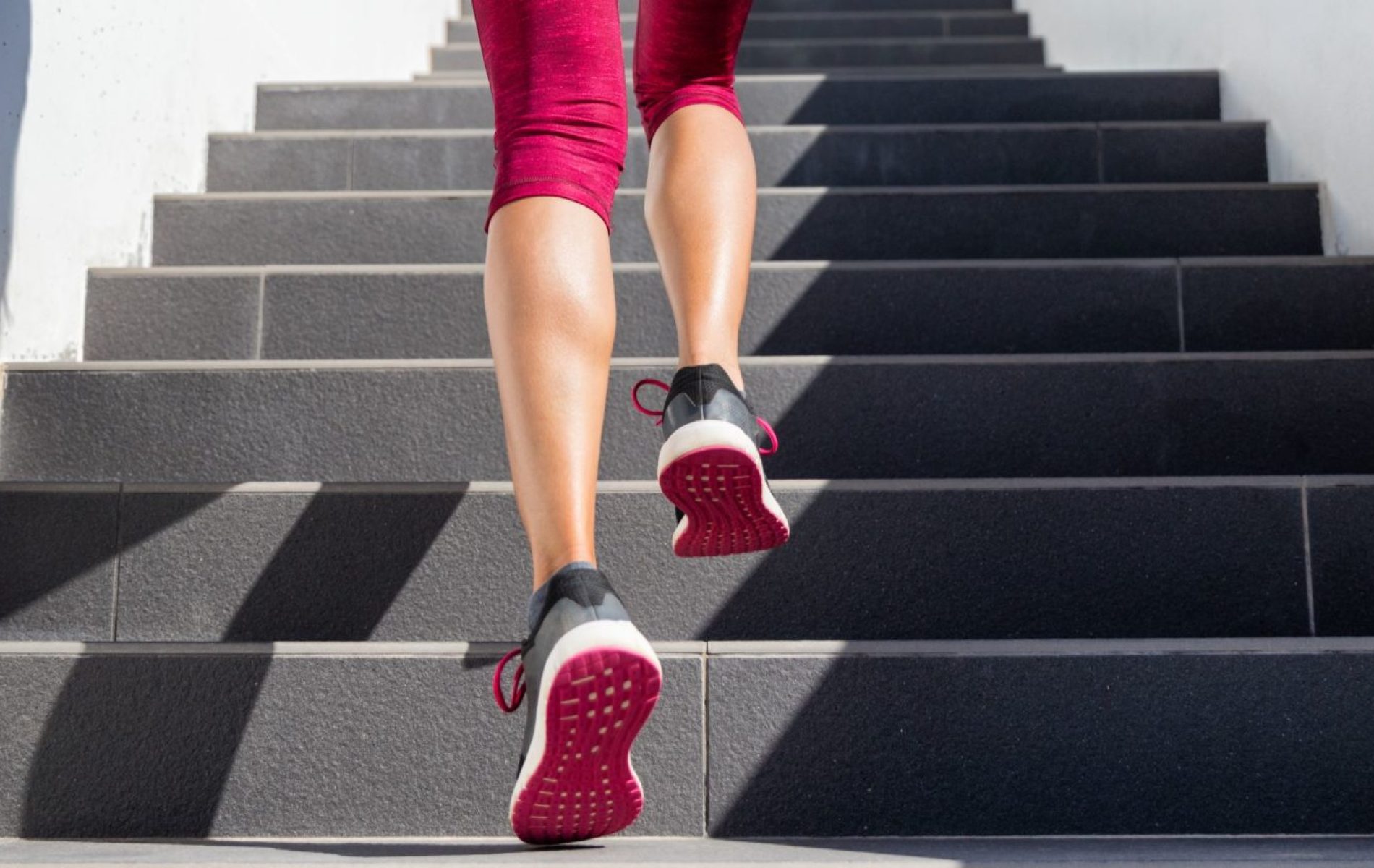 woman running up stairs interval training